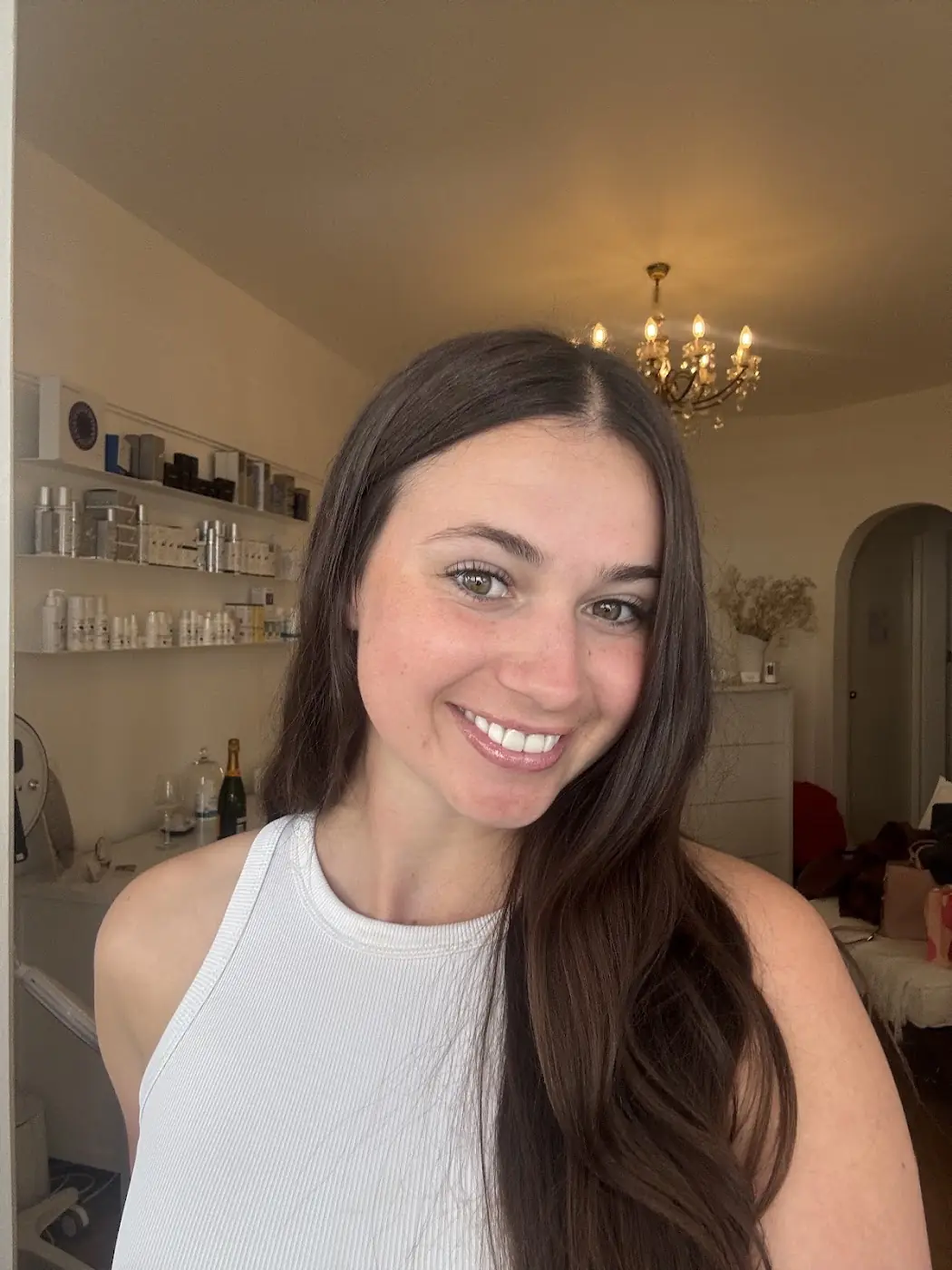 A smiling client inside the Pinky Beauty studio in Randwick