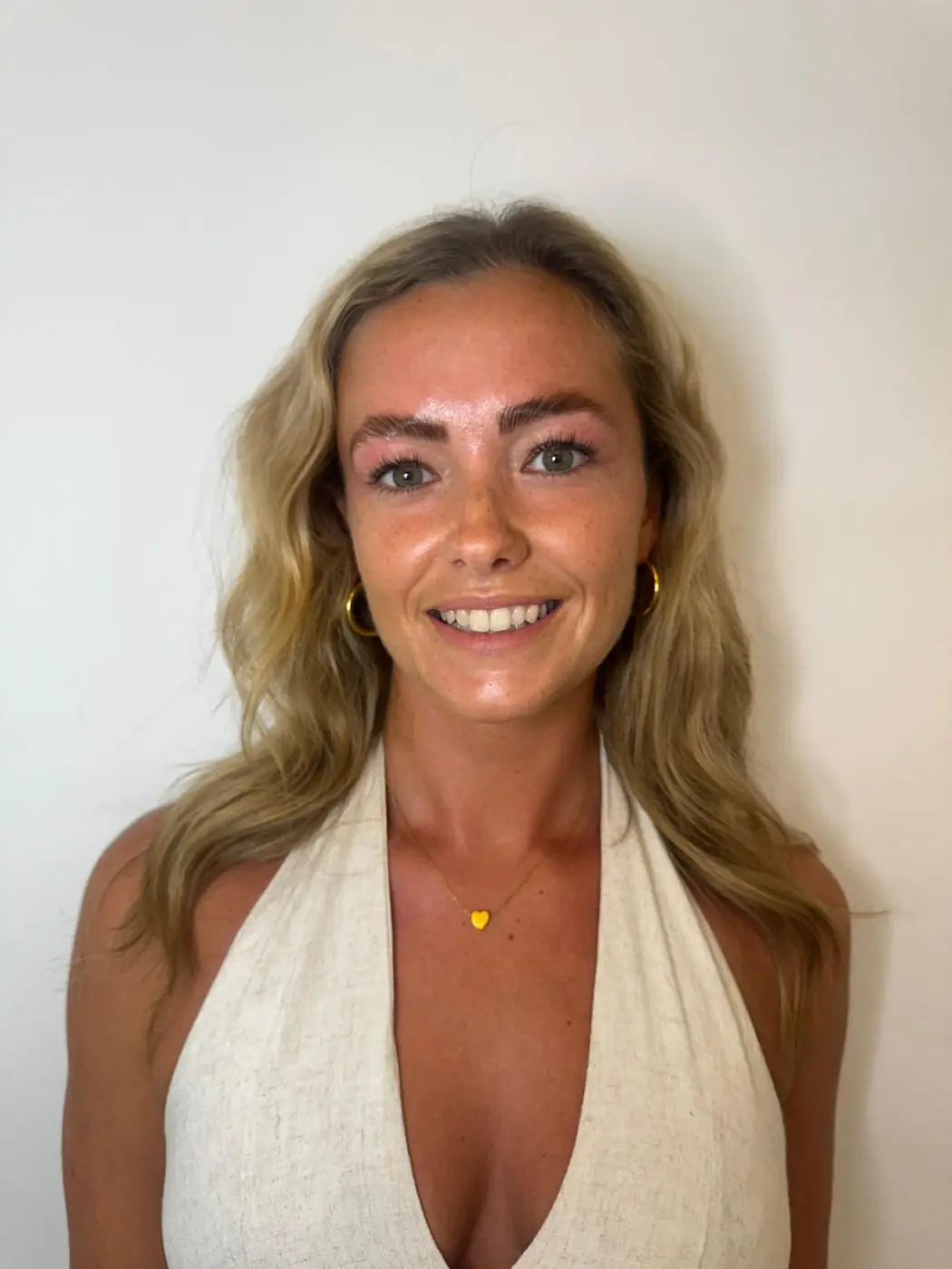 A smiling client after her appointment